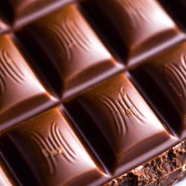 an extreme macro shot of a chocolate bar with a focus on the surface details of the chocolate, including any cracks, textures, and the smoothness of the cocoa clipart