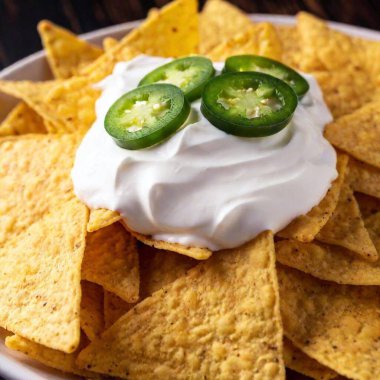 mexican nachos with jalapeno and guacamole clipart