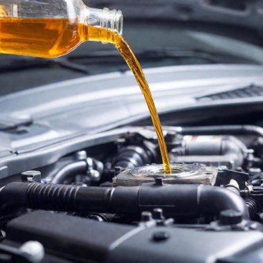 A high-resolution ultrarealistic image of a car engine during an oil change. This photograph captures the detailed environment of an engine compartment, with a silver engine block taking the central stage. In the foreground, a translucent oil bottle clipart