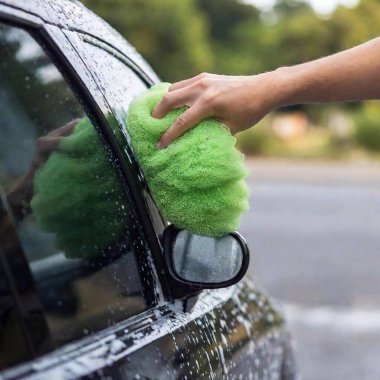 woman washing car with a rag clipart