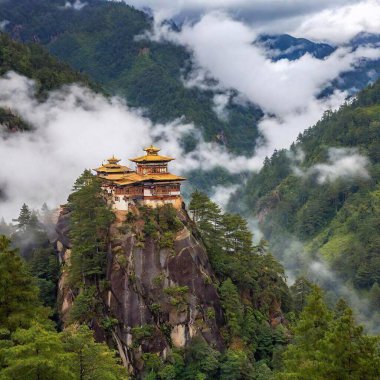 A high-resolution ultrarealistic image captures the iconic Paro Taktsang monastery, a sacred structure nestled precariously on the edge of a towering rocky cliff amidst lush green forests. The monastery exhibits traditional Bhutanese architectural clipart