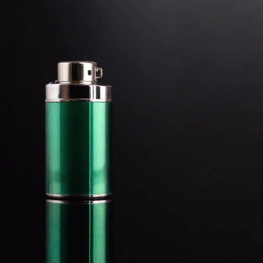 a close-up photograph of a green plastic lighter on a black background, focusing on the surface details and reflections to showcase the contrast between its glossy finish and the matte backdrop clipart