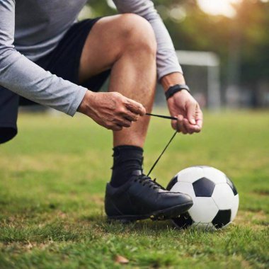 Close-up of senior male player tying shoelaces, cropped section  clipart