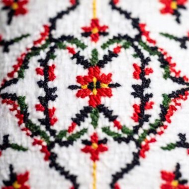 Close-up macro shot of french folk embroidery from the Northern regions, highlighting the detailed patterns and bright colors clipart