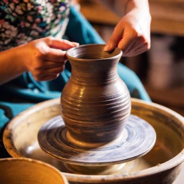 macro photo of female hands creating handcrafted vase clipart