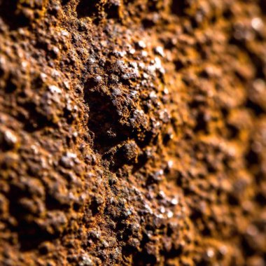 Extreme macro of a rusted metal surface, showing the texture and corrosion details. clipart