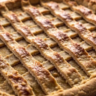 Close-up of a tart crust with finely detailed edges. clipart