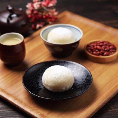 Mochi (Japan)  A Japanese rice cake made of mochigome, a short-grain japonica glutinous rice, often filled with sweet red bean paste. clipart