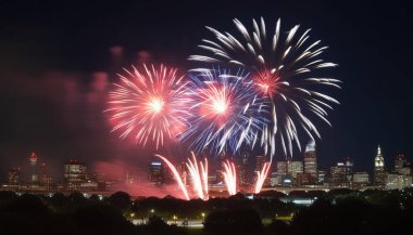 Fireworks exploding in the night sky, creating a dazzling display of red, white, and blue, with a blurred city skyline in the background. clipart