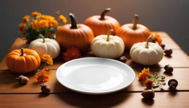 Close up of a white plate on a wooden table, with a border of pumpkins, acorns, and autumn flowers surrounding it, with warm ambient light falling across the surface. clipart