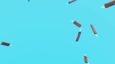 Yavaş çekim animasyon videosu. Çikolatalı dondurmanın şeker mavisi arka planda yağmuru.