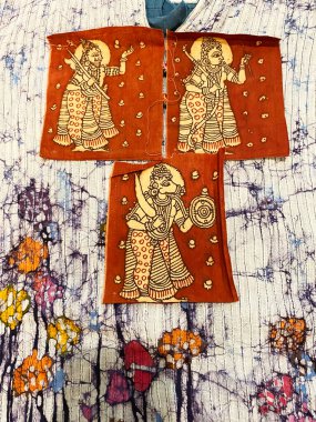 Traditional Deities figurative kalamkari patch on white and blue battik fabric clipart