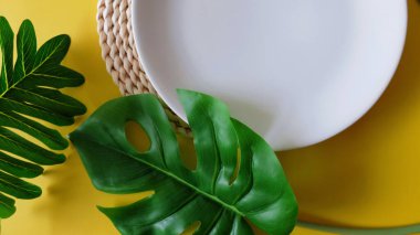 Empty Dish Plates With Planting Decoration, Empty Dish on Yellow Background, Copy Space