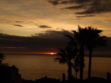 sunset over the sea and a cloudy sky