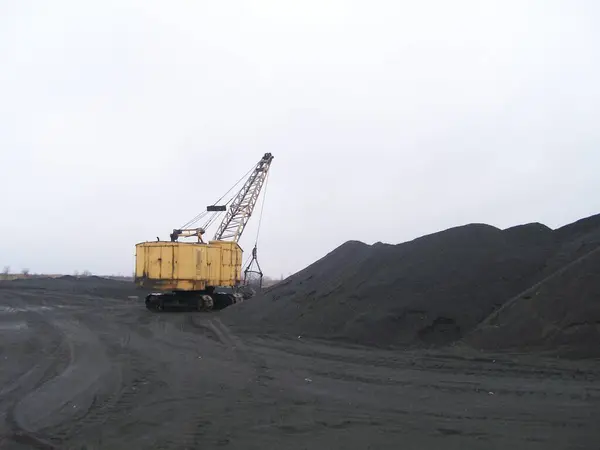 Stock image Large excavator on tracks in a coal mine.