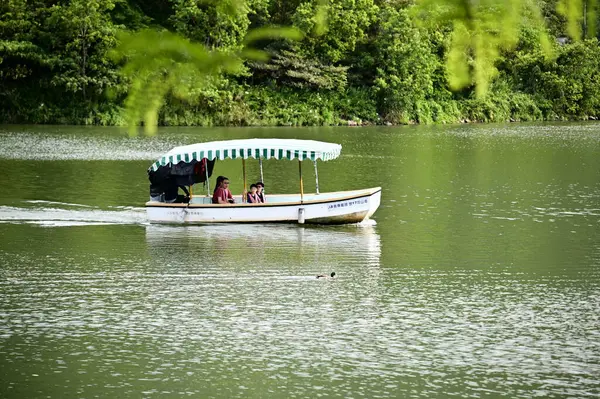 Stock image Taiwan - 06.22.2024: Meihua Lake in Dongshan, Yilan, is a renowned tourist destination where visitors can enjoy boat tours amidst scenic landscapes, tranquil surroundings, and lush greenery.