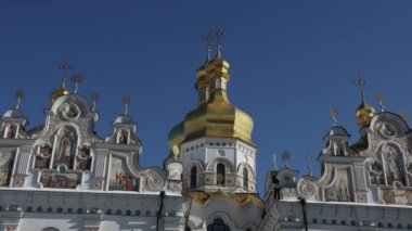 Beautiful view of the Assumption Cathedral of the Kiev-Pechersk Lavra. View of the cathedral from the outside. Beautiful golden domes and blue skies.
