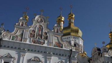 Beautiful view of the Assumption Cathedral of the Kiev-Pechersk Lavra. View of the cathedral from the outside. Beautiful golden domes and blue skies.