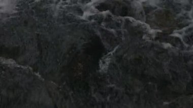 The water flows beautifully over the rocks. Mountain river. Beautiful little waterfalls. Beautiful streams and small waterfalls near the big Carpathian waterfall Shypit.