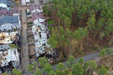 Hostomel, Kyev region Ukraine - 09.04.2022: Top view of the destroyed and burnt houses. Houses were destroyed by rockets or mines from Russian soldiers. Cities of Ukraine after the Russian occupation.