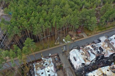 Hostomel, Kyev region Ukraine - 09.04.2022: Top view of the destroyed and burnt houses. Houses were destroyed by rockets or mines from Russian soldiers. Cities of Ukraine after the Russian occupation.