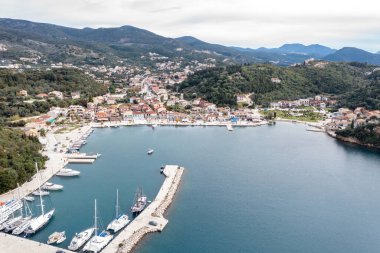 Sailboats anchored in Syvota village marina, aerial drone view. Sailing in Greece, summer vacation destination. clipart