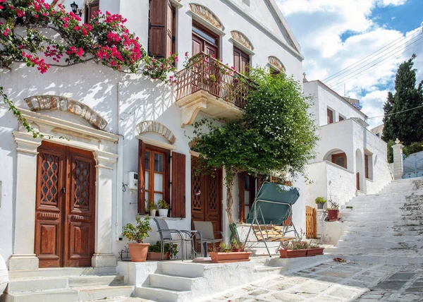 stock image Greece. Tinos island of art, Cycladic architecture at Pyrgos village paved street, whitewashed wall, stair, sunny day.