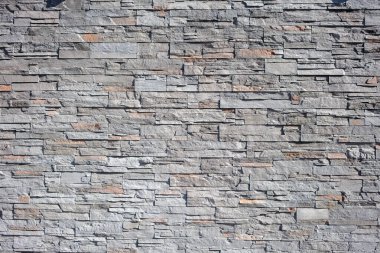 Boş taş duvar arkaplan dokusu. Granit duvar ustası, mozaik yapı, sağlam gri çit yapısı. Boşluğu kopyala