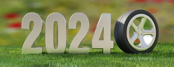 2024 풀밭의 배경에 숫자의 바퀴에 타이어를 — 스톡 사진