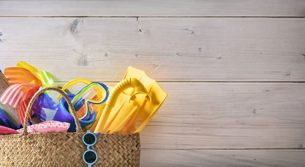 stock image Family summer vacation accessories on white wood background, copy space. Summer holidays on the sea