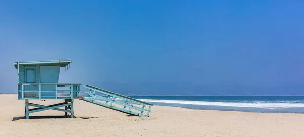 Lifeguard hut on Santa Monica beach. Pacific ocean coastline Los Angeles USA,  banner, copy space