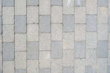 Boş parke taşı gri taş kaldırım arka plan dokusu. Asfalt zemin, arka plan için gri granit patika, manzaranın üstünde. Boşluğu kopyala