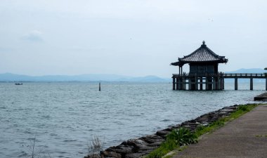 Ukimido temple hall floating on Lake Biwa, belonging to Mangetsuji Buddhist temple in Otsu city, Shiga Prefecture, Japan clipart