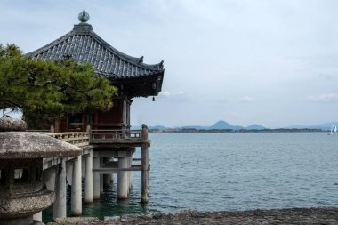 Ukimido temple hall floating on Lake Biwa, belonging to Mangetsuji Buddhist temple in Otsu city, Shiga Prefecture, Japan clipart