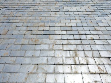 Roof tile backround texture, Grey color slate stone tiles house roof construction detail, closeup view clipart