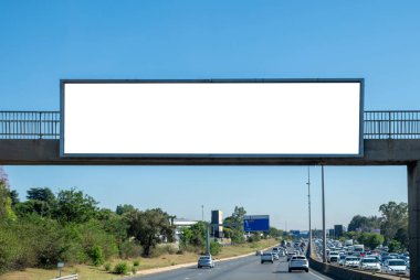 Blank empty billboard mockup template for advertising over a highway in South Africa. Blue sky clipart