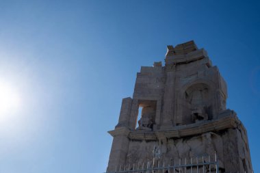 Athens, Greece, Philopappos Monument up on the hill, blue sky background clipart