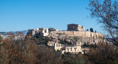 Athens, Greece. Parthenon and Propylaea, Acropolis hill and Herodeion, clear blue sky. View from Philopappos hill clipart