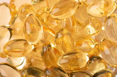 Omega 3 arka planında balık yağı var. Vitaminler yumuşak kapsüller. Morina yağı. Sağlık, takviye, D vitamini, hastalıkların tedavisi kavramı. Uzayı kopyala, afiş. Yüksek kalite fotoğraf