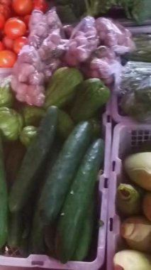 A captivating video showcasing fresh vegetables at the market. Carrots, cucumbers, tomatoes, and chayote squash create a colorful and healthy display, perfect for culinary and nutrition themes.