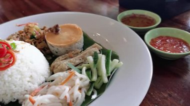 Experience the vibrant colors and tantalizing aromas of this exquisite Vietnamese broken  rice, a culinary masterpiece that showcases the rich flavors and time-honored traditions of Asian cuisine.