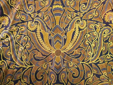 Soyut desenli, birincil renk olarak altın rengi olan Batik. Batik Endonezya 'dan güzel bir sanat eseridir. Geleneksel Batik 'teki desenler, görsel ve felsefi güzelliği temsil ediyor.