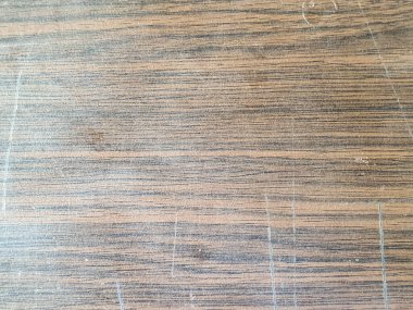 A close-up shot of a wooden veneer surface texture with a rich, dark brown color and a distinct wood grain pattern clipart