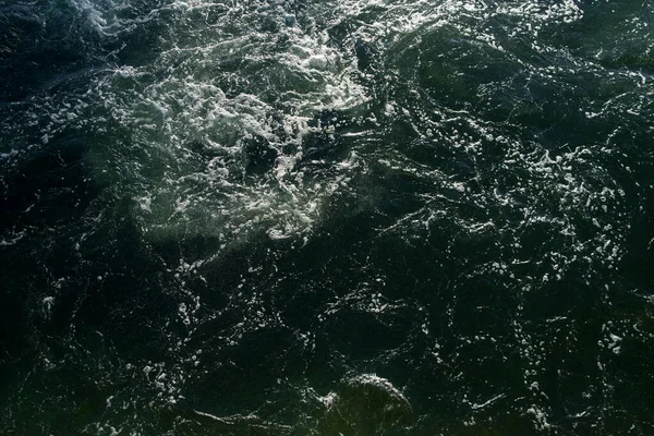 stock image Churning ocean water, overhead view, foam and waves.