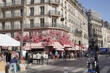 Paris France October 8, 2023 rue Saint-Antoine in the Marais district and la Favorite restaurant with its floral decoration facade clipart