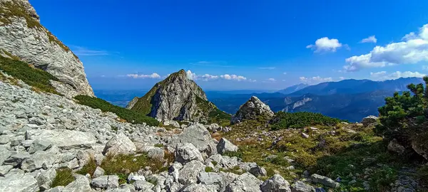 stock image Journey to the mountains. Hiking in the Tatra Mountains. Mountain peaks with valleys between them. Active lifestyle.