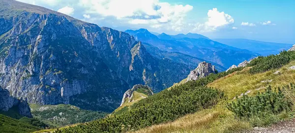 stock image Journey to the mountains. Hiking in the Tatra Mountains. Mountain peaks with valleys between them. Active lifestyle.