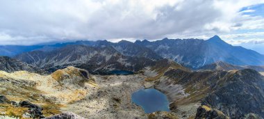 Lakes between mountains. Hiking as a favorite hobby. Active lifestyle. Views of the Tatra Mountains and the High Tatras from hiking trails. Peaks, slopes and valleys between mountains clipart