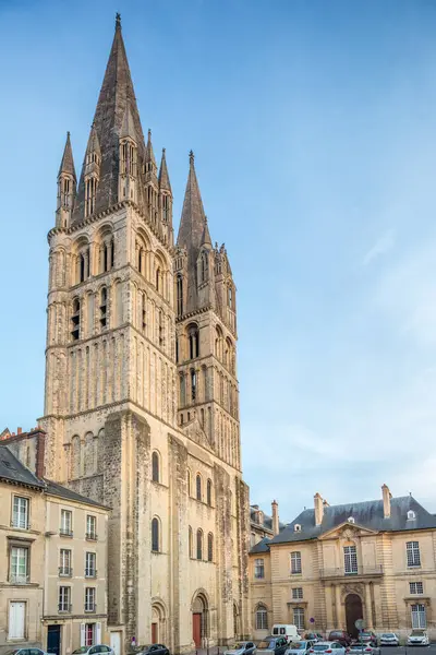 stock image The historic Men's Abbey in Caen showcases Gothic spires against a serene sky.