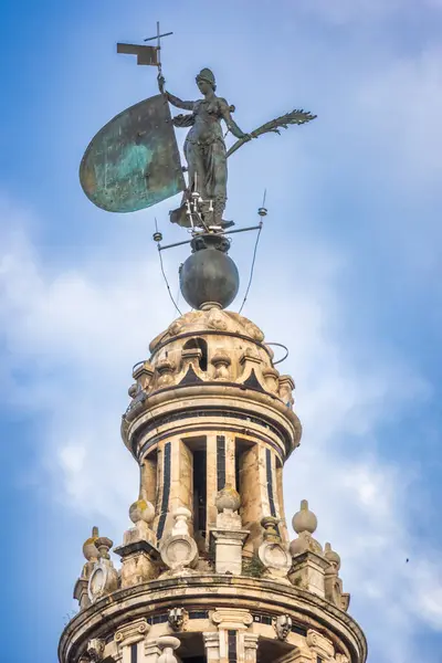 stock image Close-up of the statue of Faith at the top of La Giralda, the iconic bell tower in Seville, Spain.